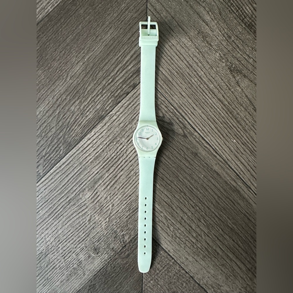 Woman’s dainty baby blue swatch watch